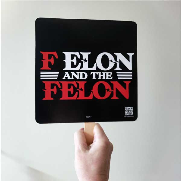 Person holding F Elon Hand Fan
