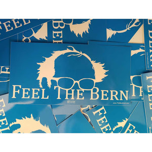 Blue stickers with 'Feel The Bern' text and sunglasses design on a blue background.