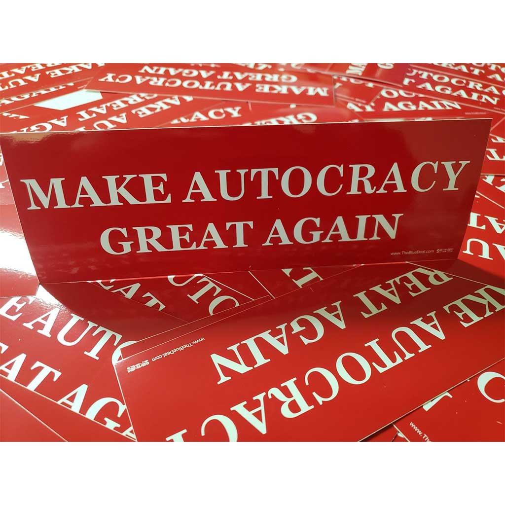 Red stickers with 'MAKE AUTOCRACY GREAT AGAIN' text on a white background