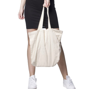 Woman holding a medium tote bag