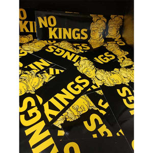 Pile of NO KINGS bumper stickers