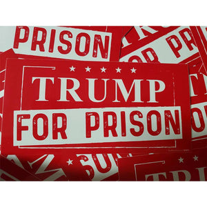 Red and white political stickers with text on a white background